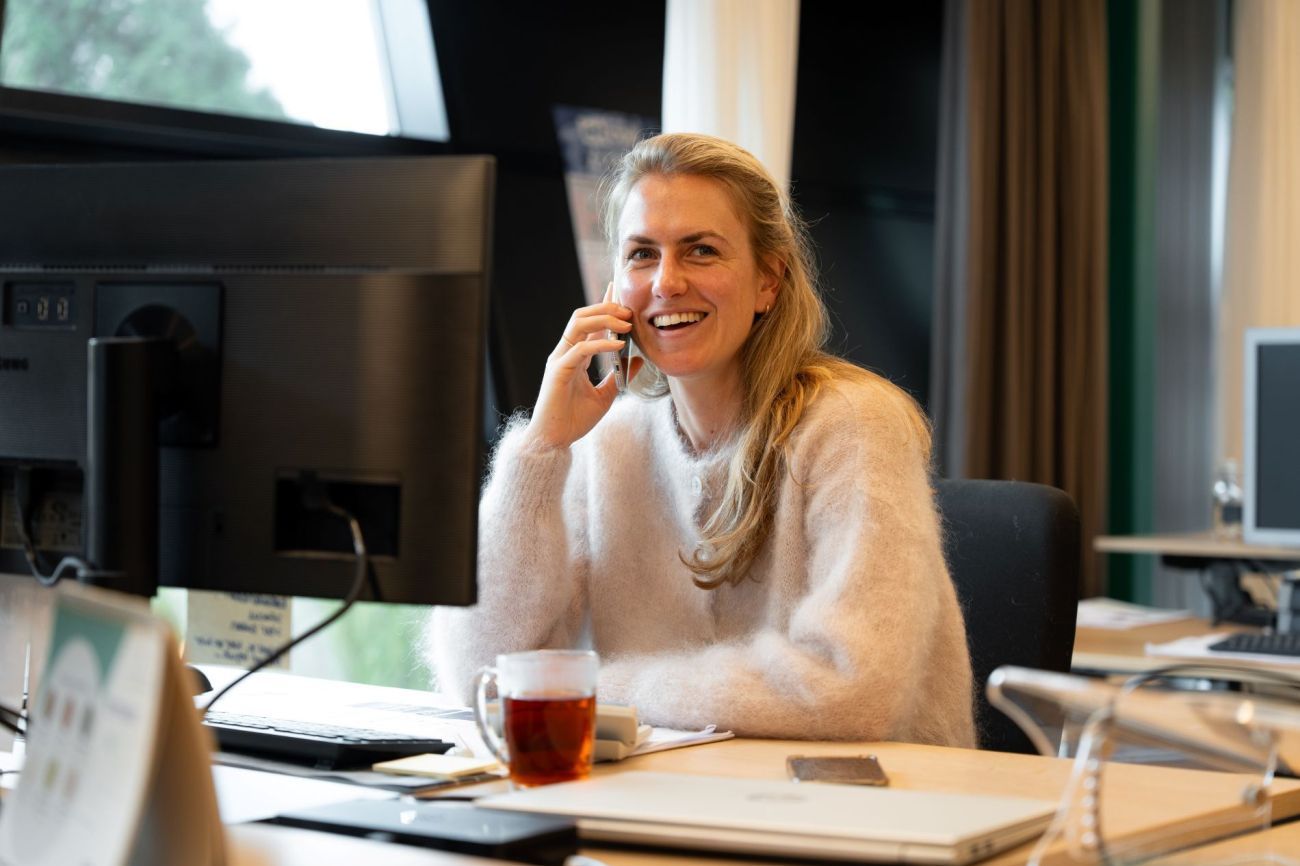 Our colleague Rhodee on the phone