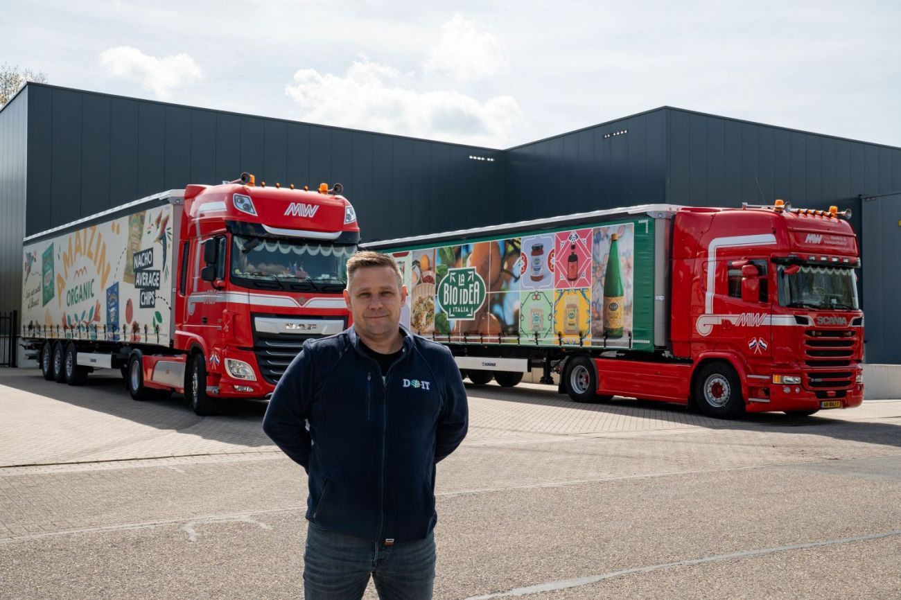 Vincent in front of our trucks